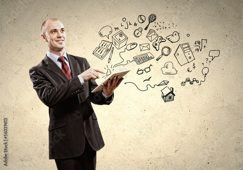 Photo: Businessman with ipad in hands Businessman with ipad in hands