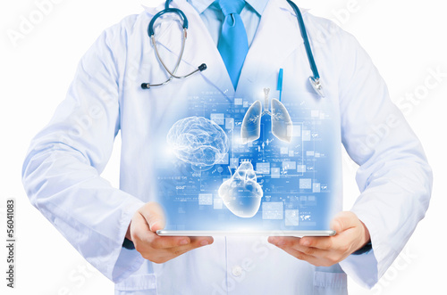 Photo: Doctor holding tablet pc Doctor holding tablet pc