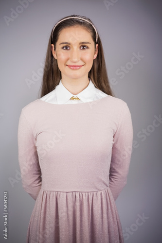 Photo: Happy pretty model with pink dress on posing Happy pretty model with pink dress on posing