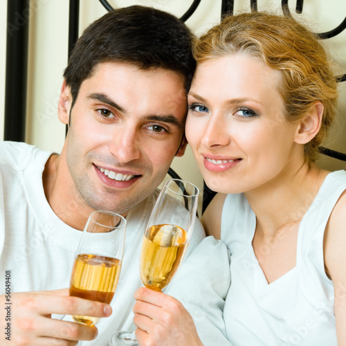 Photo: Cheerful couple with champagne Cheerful couple with champagne