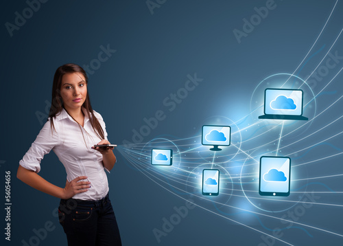 Photo: Pretty lady typing on smartphone with cloud computing Pretty lady typing on smartphone with cloud computing