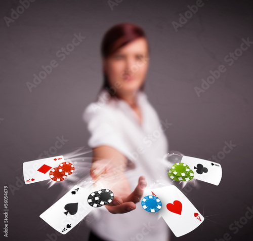 Photo: Young woman playing with poker cards and chips Young woman playing with poker cards and chips