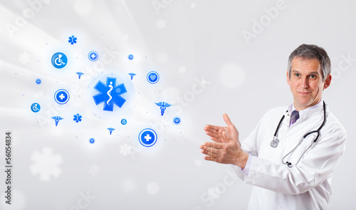 Photo: Doctor with blue medical icons Doctor with blue medical icons