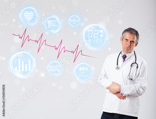Photo: Doctor examinating modern heartbeat graphics Doctor examinating modern heartbeat graphics