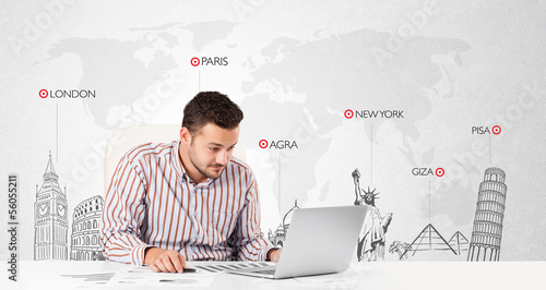 Photo: Businessman with world map and major landmarks of the world Businessman with world map and major landmarks of the world