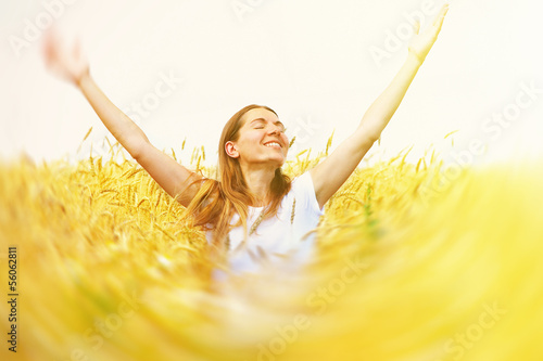 Photo: Happy woman in meadow. Happy woman in meadow.