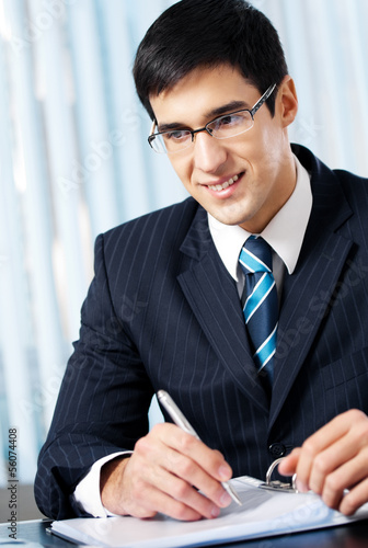 Photo: Businessman working at office Businessman working at office