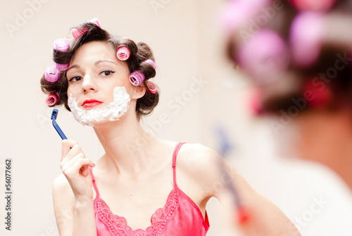 Photo: Beautiful funny girl shaving with foam & razor her face Beautiful funny girl shaving with foam & razor her face