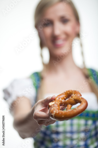 Photo: Woman with a crisp baked pretzel Woman with a crisp baked pretzel