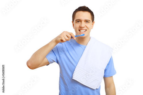 Photo: Young man with tooth brush Young man with tooth brush