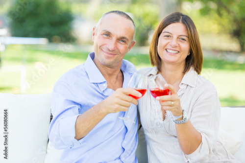 Photo: Mature Couple Having an Aperitif Outdoor Mature Couple Having an Aperitif Outdoor