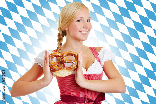 Photo: Woman with pretzel in a dirndl Woman with pretzel in a dirndl