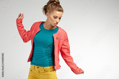 Photo: Beautiful high fashion model in autumn clothes posing Beautiful high fashion model in autumn clothes posing