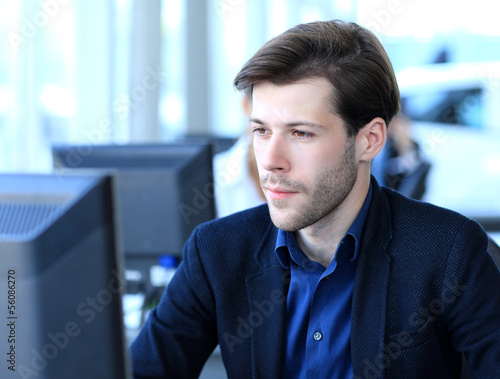 Photo: Businessman using laptop Businessman using laptop
