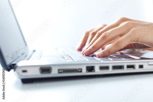 Photo: Hands typing on the laptop Hands typing on the laptop