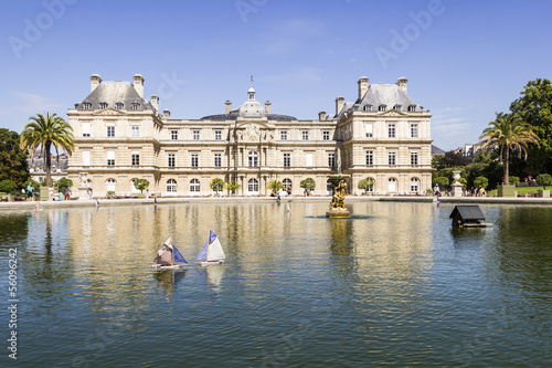 Photo: Traditional small wooden sailing boat in the pond of park Jardin Traditional small wooden sailing boat in the pond of park Jardin