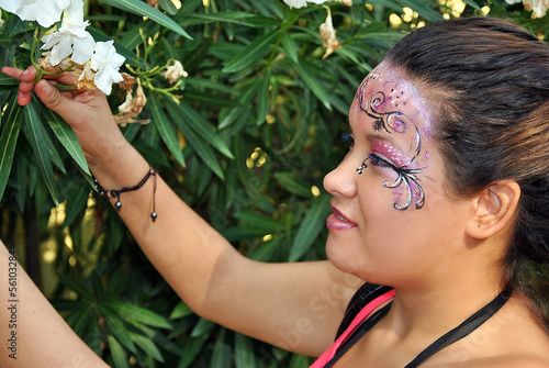 Photo: Woman with face painted Woman with face painted