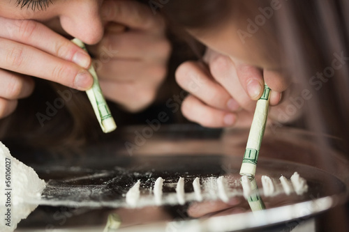 Photo: Two girls snorting an illegal substance Two girls snorting an illegal substance