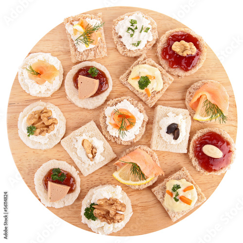 Photo: isolated assortment of canape,toast isolated assortment of canape,toast