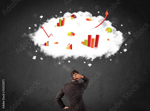 Photo: Businessman with charts in a cloud above his head Businessman with charts in a cloud above his head