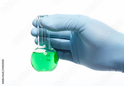 Photo: Hand with a test tube. Hand with a test tube.