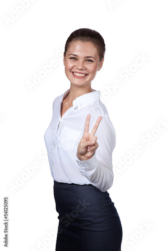 Photo: Brunette shows a symbol of victory Brunette shows a symbol of victory