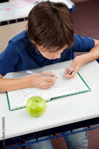 Photo: Schoolboy Copying From Cheat Sheet During Examination Schoolboy Copying From Cheat Sheet During Examination