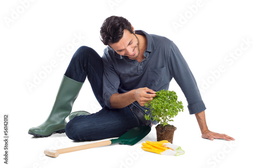 Photo: Happy Gardner Takes Care Of The Plant Happy Gardner Takes Care Of The Plant