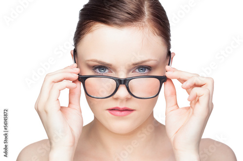 Photo: Content natural model looking over her classy glasses Content natural model looking over her classy glasses