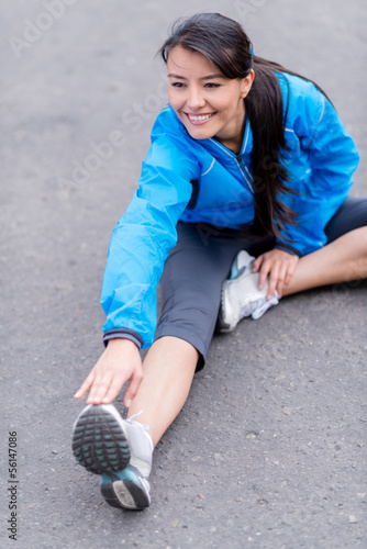 Photo: Fit woman stretching Fit woman stretching