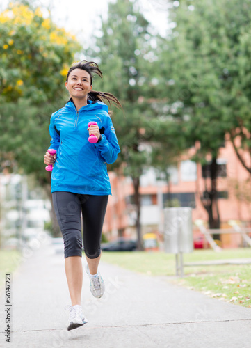 Photo: Woman running outdoors Woman running outdoors