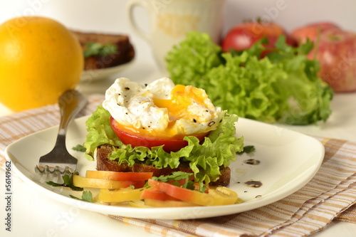Photo: Poached egg on toast with vegetables Poached egg on toast with vegetables