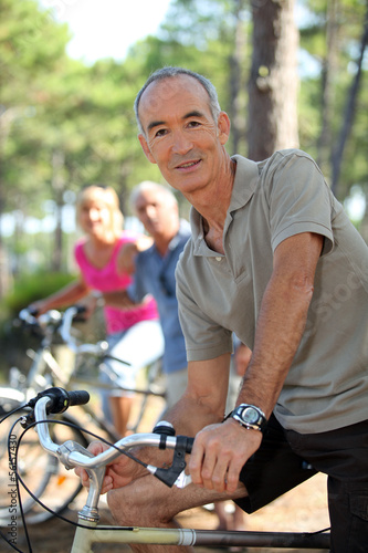 Photo: portrait of a man on a bike portrait of a man on a bike