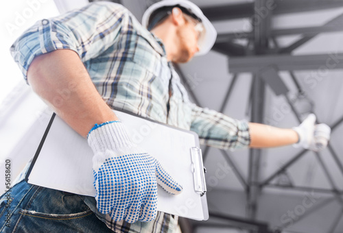 Photo: man with blueprint man with blueprint