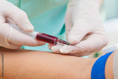 Photo: Syringe with blood sample Syringe with blood sample