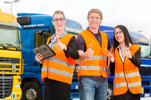 Photo: Forwarder in front of trucks on a depot Forwarder in front of trucks on a depot