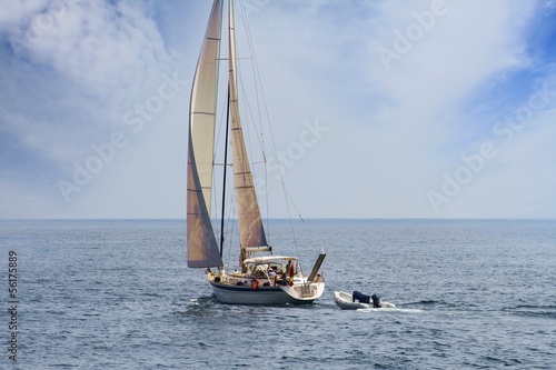 Photo: Sailing boat in open waters Sailing boat in open waters