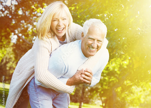 Photo: Old people over park background Old people over park background
