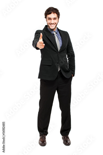 Photo: Businessman giving his hand to you Businessman giving his hand to you