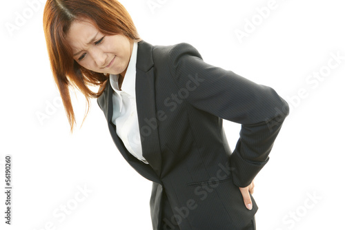 Photo: 腰痛に悩むOL 腰痛に悩むOL