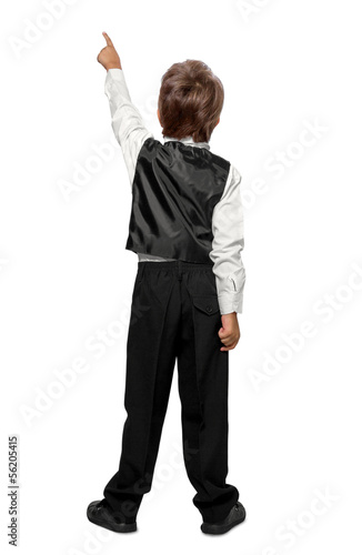 Photo: Child in a tuxedo pointing at wall. Rear view. Isolated over wh Child in a tuxedo pointing at wall. Rear view. Isolated over wh