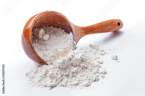 Photo: classic wooden dipper with flour classic wooden dipper with flour