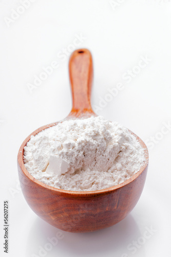 Photo: classic wooden dipper with flour classic wooden dipper with flour