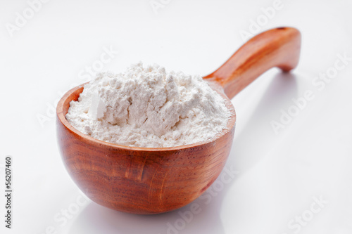 Photo: classic wooden dipper with flour classic wooden dipper with flour
