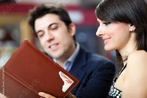 Photo: Couple reading a menu Couple reading a menu