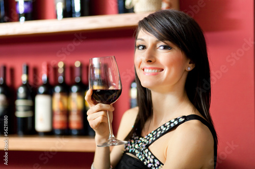Photo: Woman toasting wine Woman toasting wine