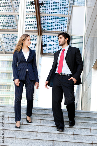 Photo: Couple of businesspeople outdoor Couple of businesspeople outdoor
