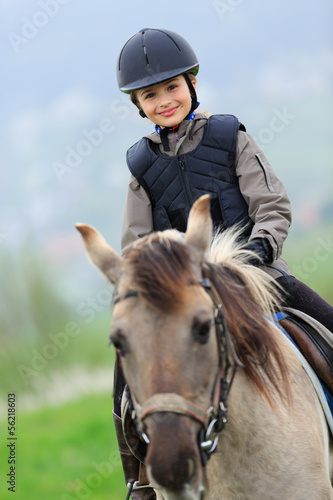 Photo: Horse and lovely equestrian girl Horse and lovely equestrian girl
