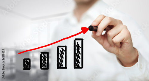 Photo: businessman drawing graph businessman drawing graph