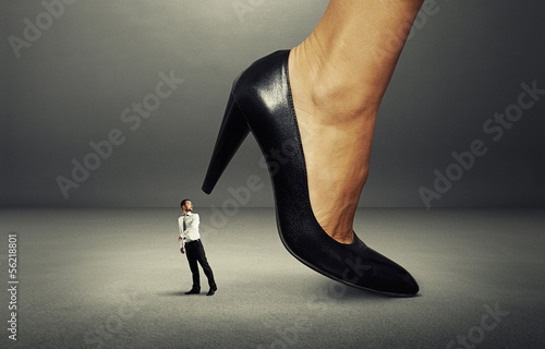 Photo: man under big heel man under big heel